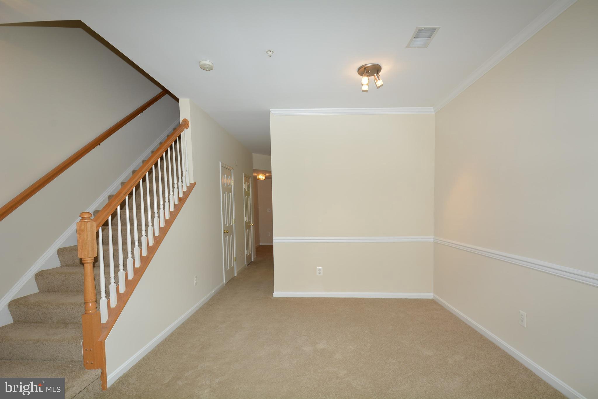 2665 Manhattan Place, Unit 101 Vienna, VA 22180 - Photo 5 of 23 a view of an empty room with stairs