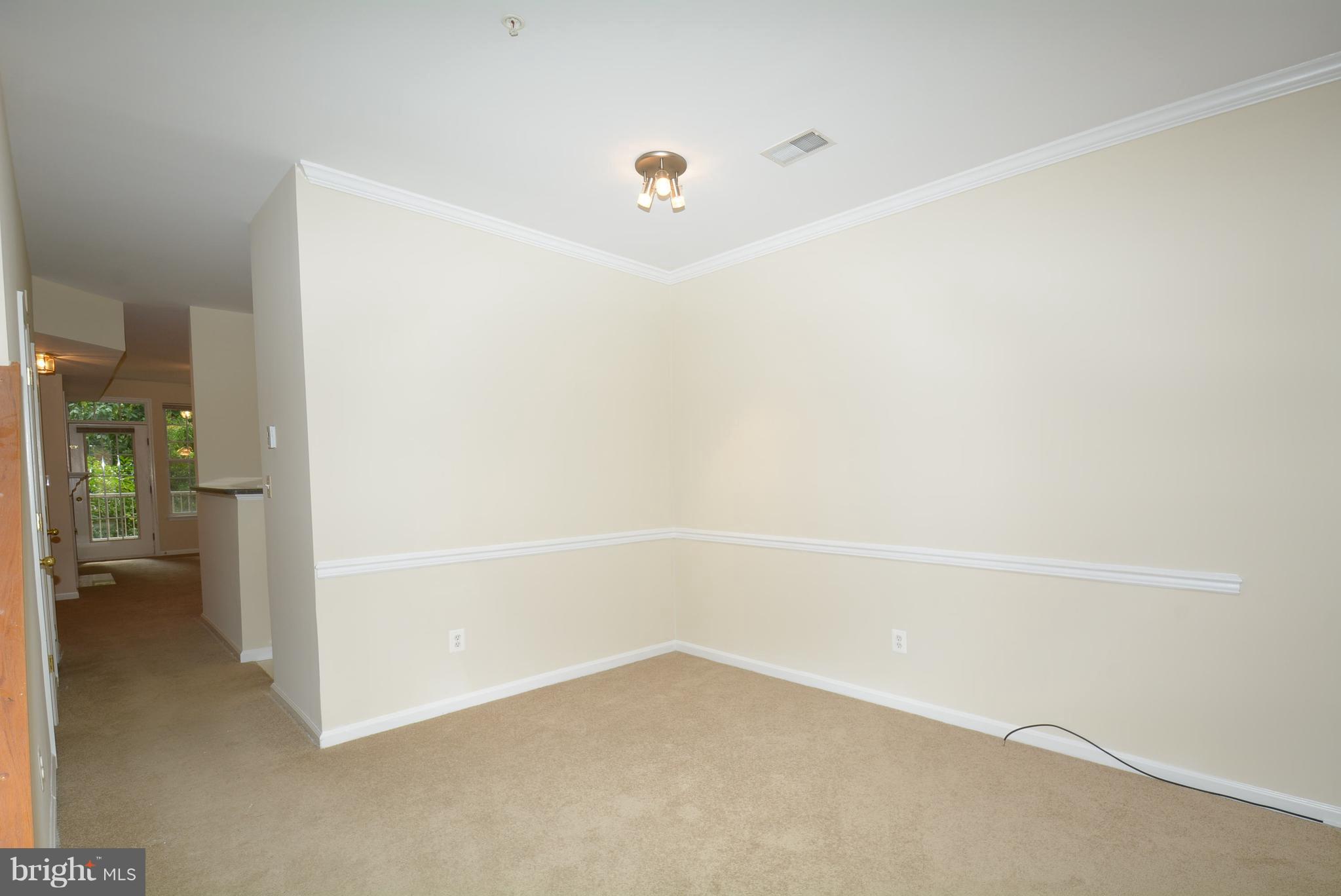2665 Manhattan Place, Unit 101 Vienna, VA 22180 - Photo 6 of 23 a view of an empty room