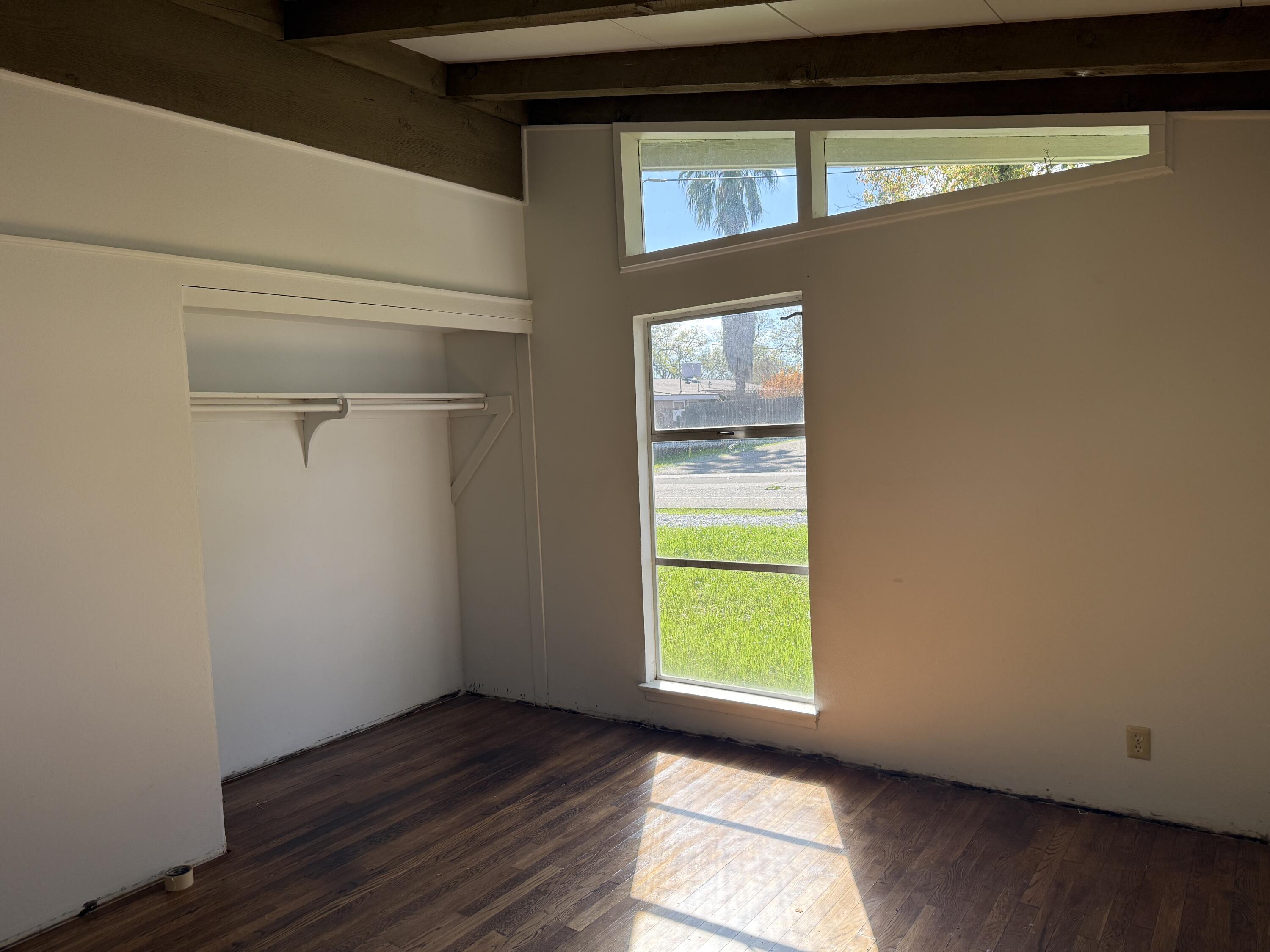 1400 Riviera Drive Redding, CA 96001 - Photo 12 of 15 a view of empty room with window and wooden floor