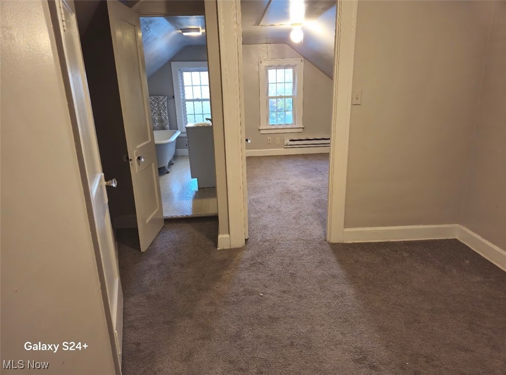 3571 Riedham Road Cleveland, OH 44120 - Photo 18 of 24 Hallway featuring dark colored carpet and lofted ceiling