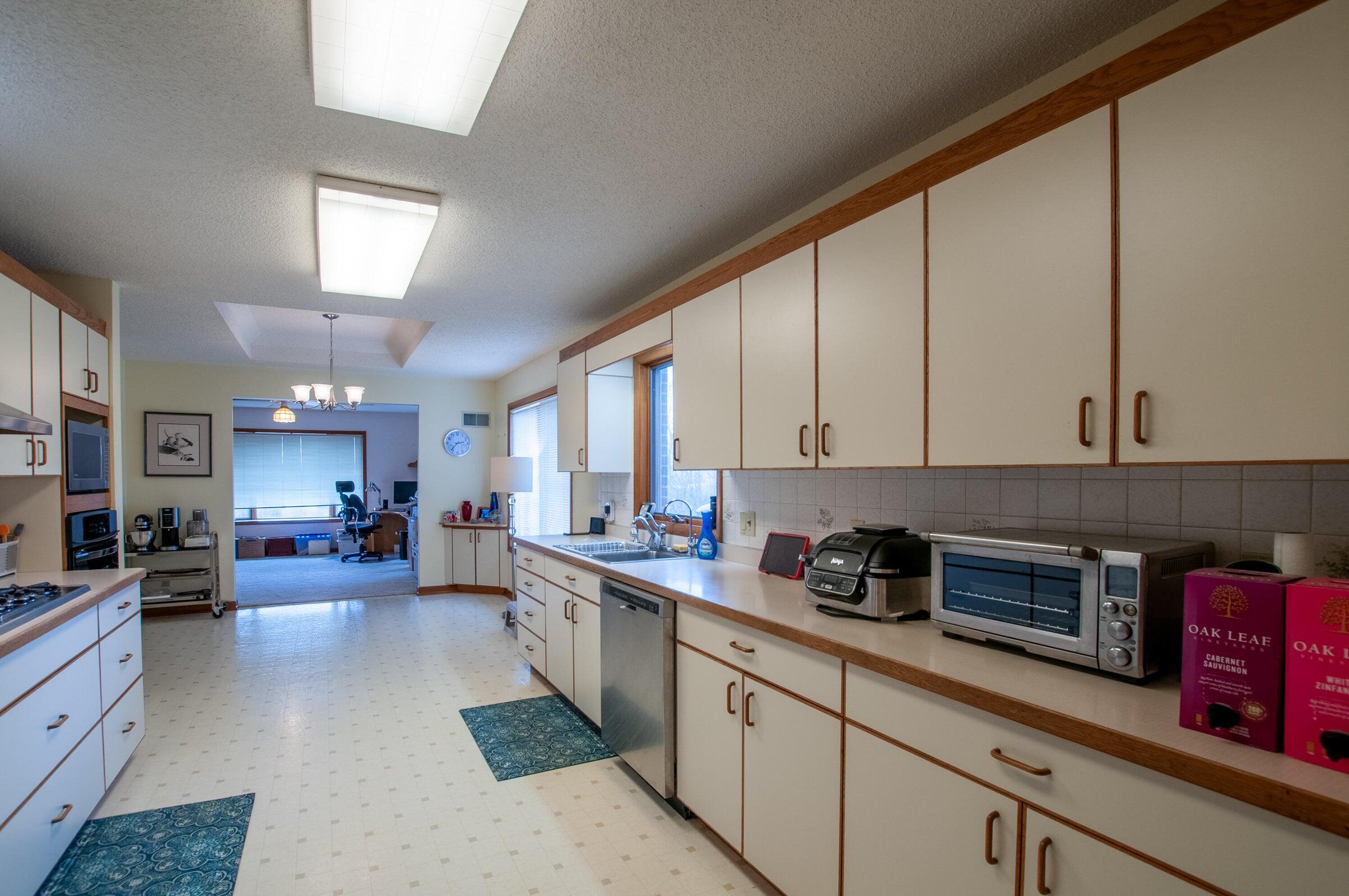 106 Merrick Lane Raphine, VA 24472 - Photo 14 of 46 a kitchen with lots of counter top space and a window