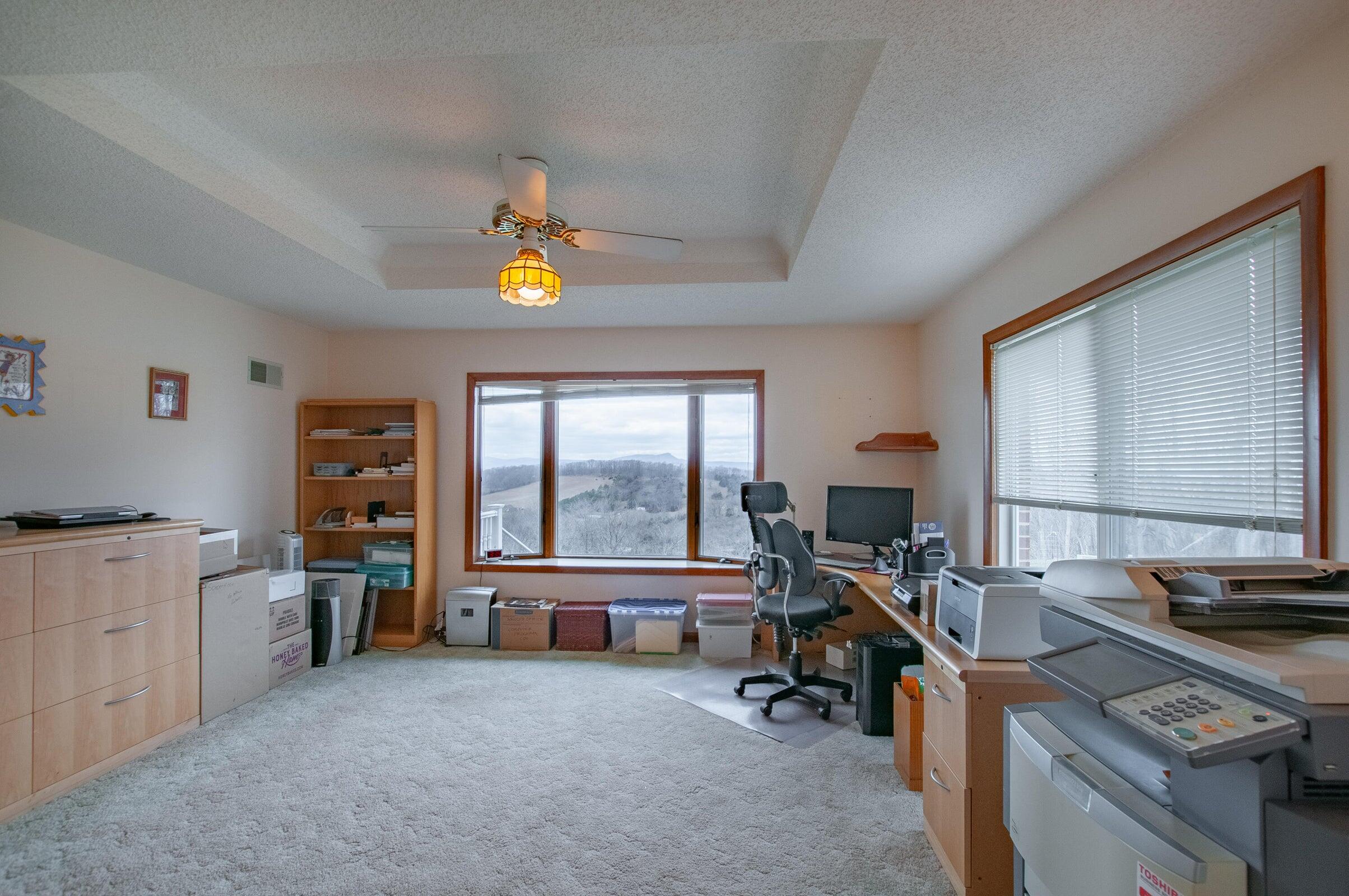 106 Merrick Lane Raphine, VA 24472 - Photo 19 of 46 a view of a workspace with furniture and a window