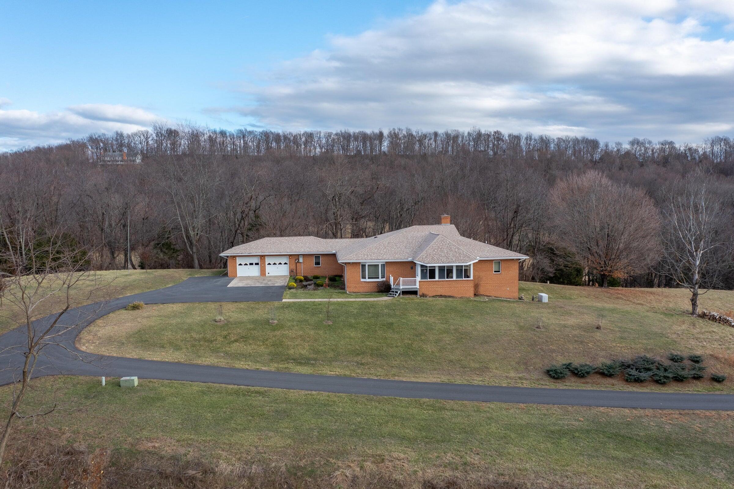 106 Merrick Lane Raphine, VA 24472 - Photo 2 of 46 a house with trees in the background