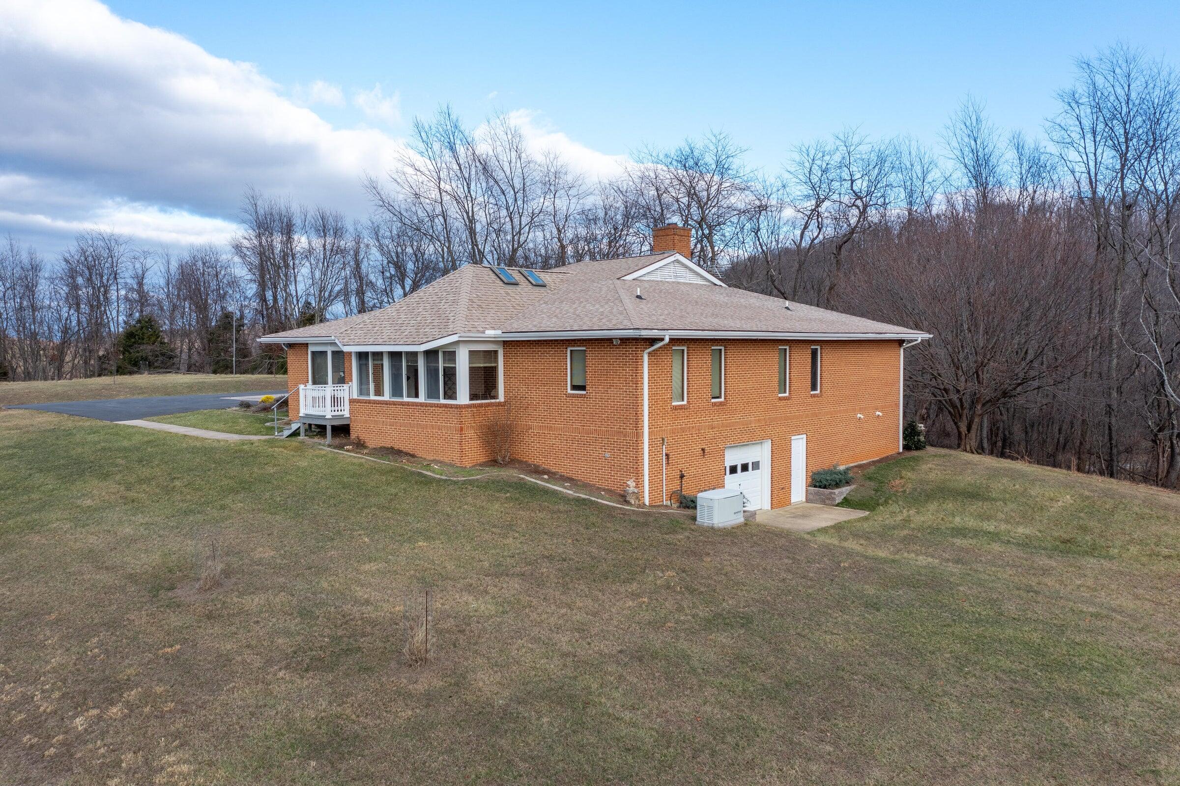 106 Merrick Lane Raphine, VA 24472 - Photo 36 of 46 a view of a house with backyard and trees