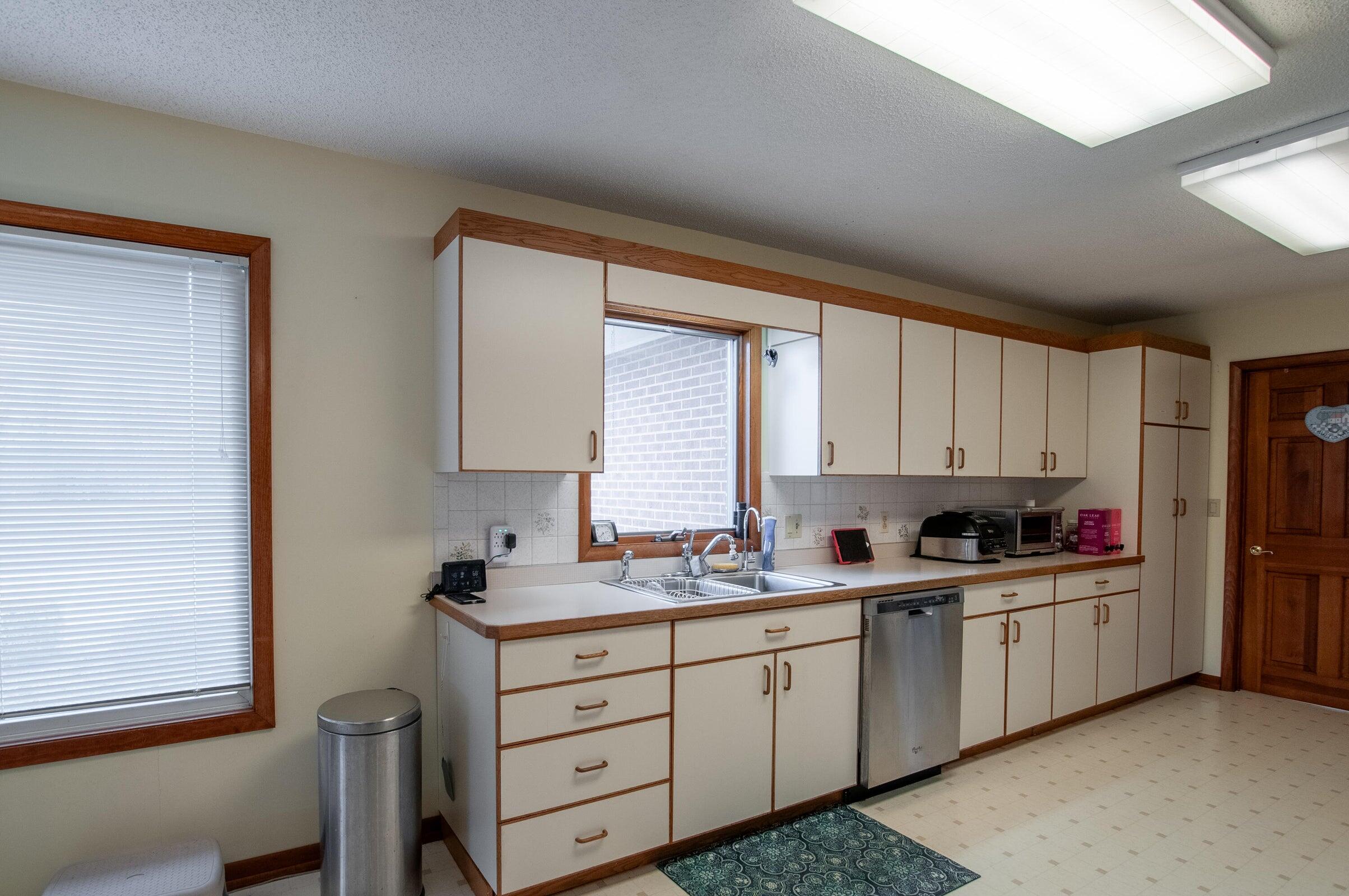 106 Merrick Lane Raphine, VA 24472 - Photo 43 of 46 a kitchen with a sink window and cabinets