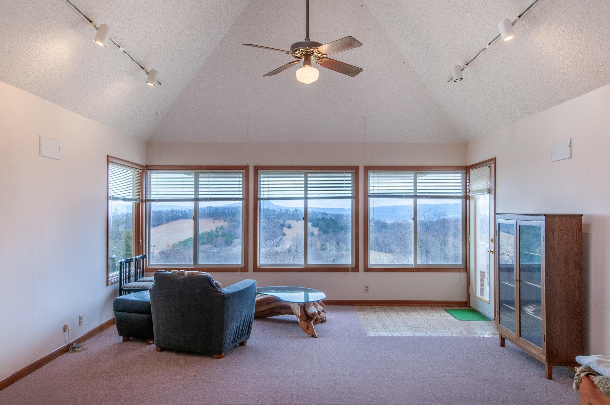 106 Merrick Lane Raphine, VA 24472 - Photo 8 of 46 a living room with furniture and large windows