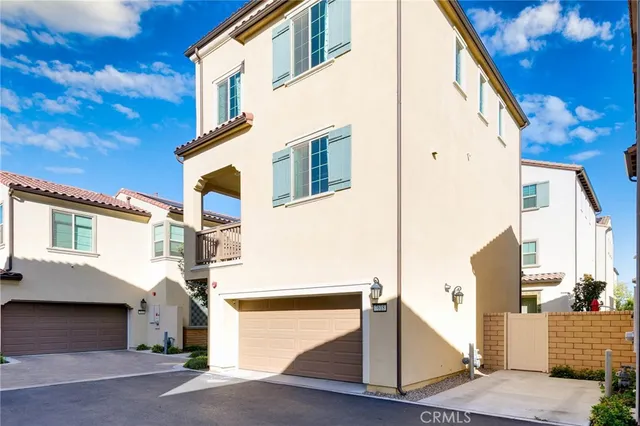 a view of a white apartments with large windows