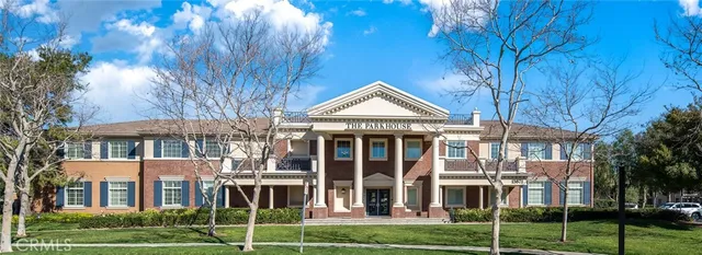 a view of a house with swimming pool and sitting area