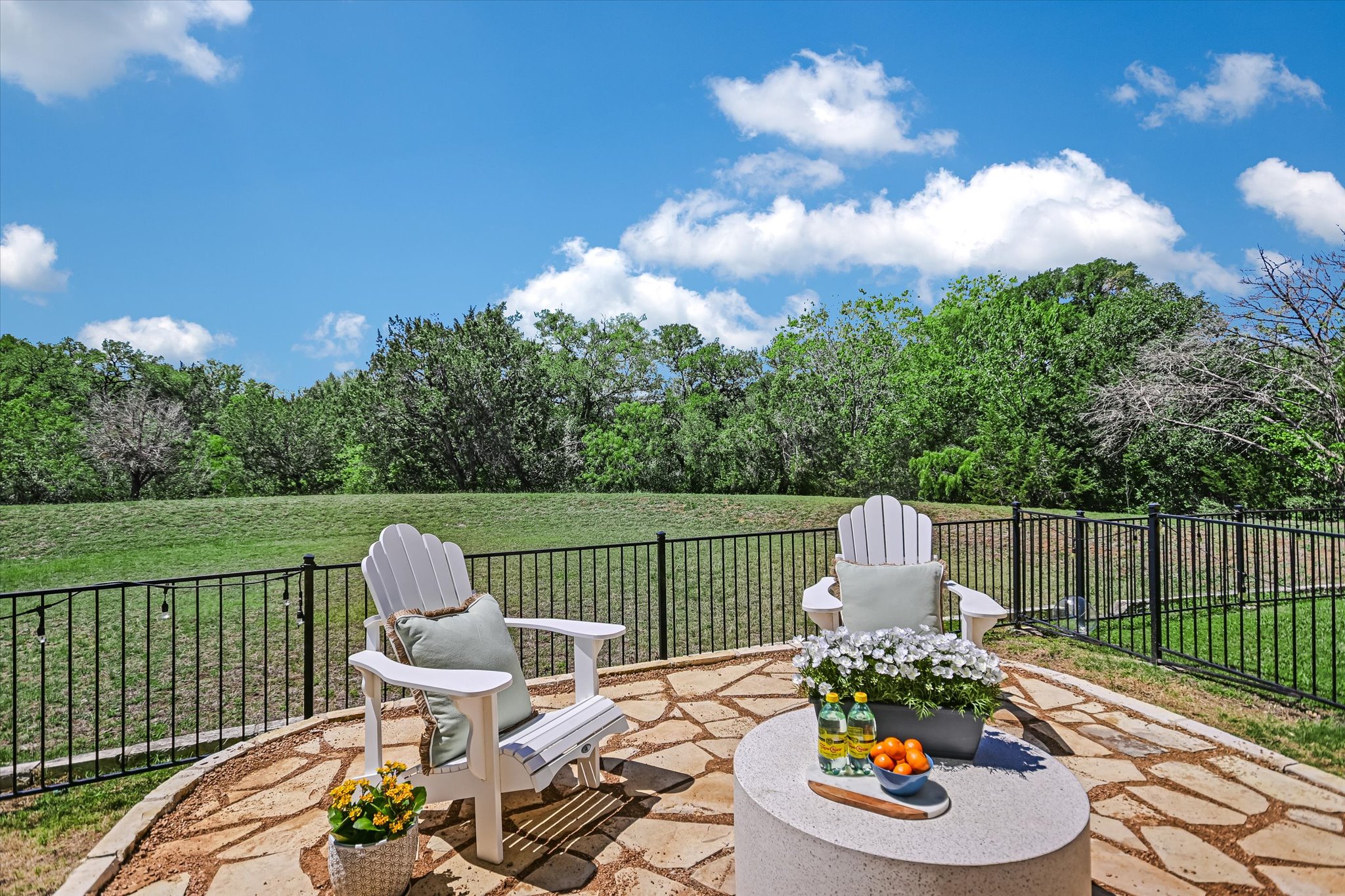 12224 Tawny Farms Road, Unit 145 Austin, TX 78748 - Photo 3 of 27 This beautiful stone patio offers plenty of room to relax and offers a serene view of the greenbelt.