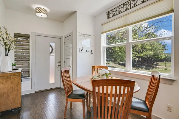 a view of a dining room with furniture window and wooden floor