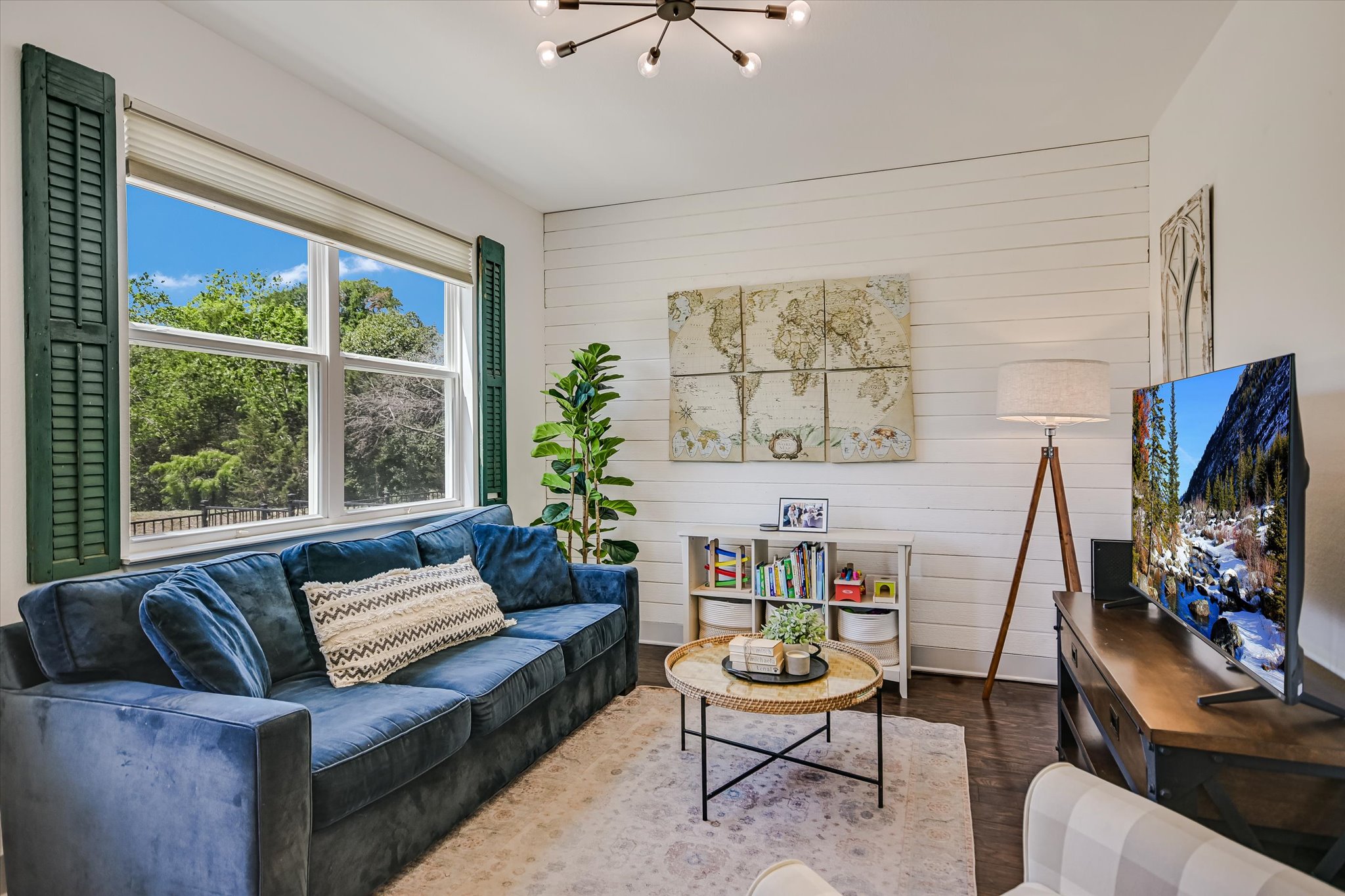 12224 Tawny Farms Road, Unit 145 Austin, TX 78748 - Photo 7 of 27 A shiplap feature wall, custom blinds and accents, and a modern light fixture add to the sweet cottage decor.
