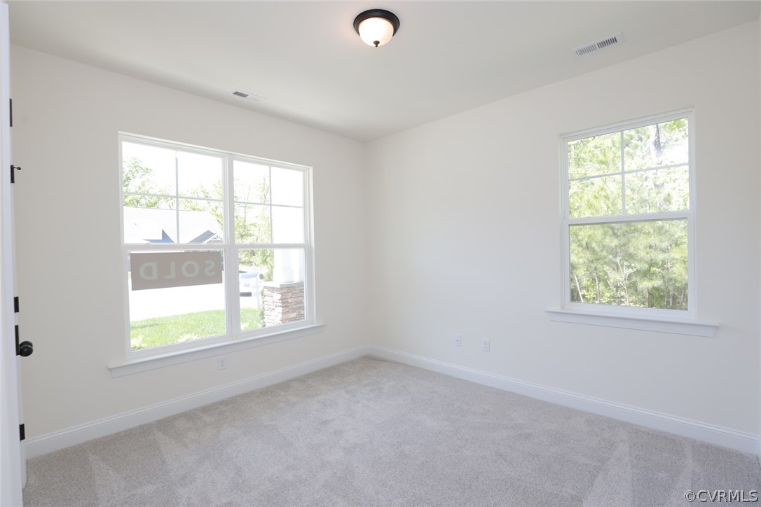 1706 Twin Rivers Court Chester, VA 23836 - Photo 23 of 32 Split bedroom design. Bedroom 2 w/ carpet and clos