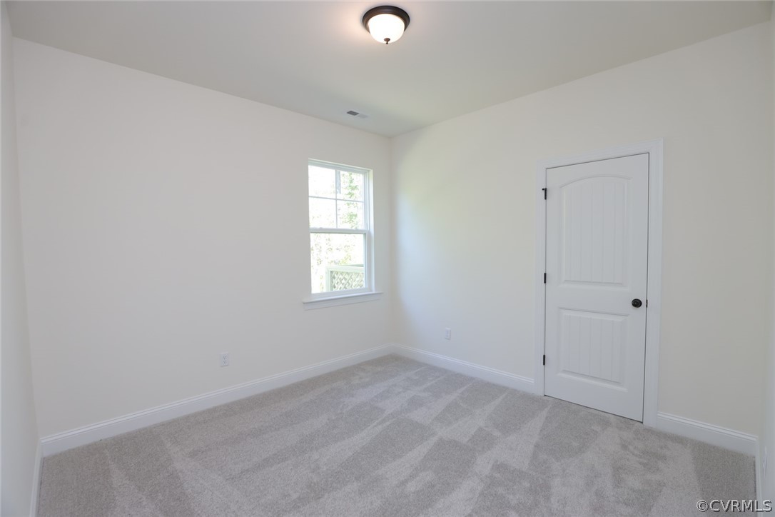 1706 Twin Rivers Court Chester, VA 23836 - Photo 24 of 32 Split bedroom design. Bedroom 2 w/ carpet and clos