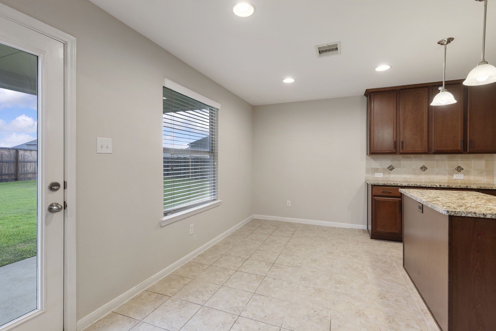 7130 Edwanna Lane Spring, TX 77389 - Photo 11 of 36 Oversized breakfast dining room is plenty big for your large dining table.