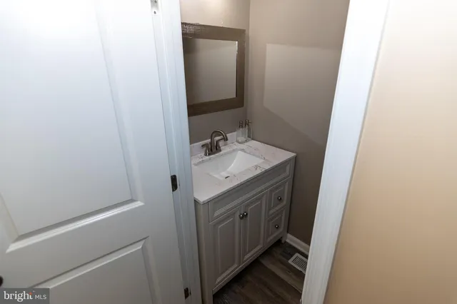 a white toilet sitting next to a shower