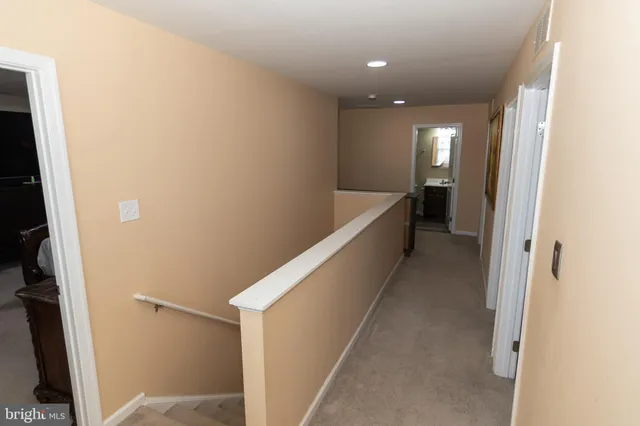 a bedroom with bed and flat screen tv