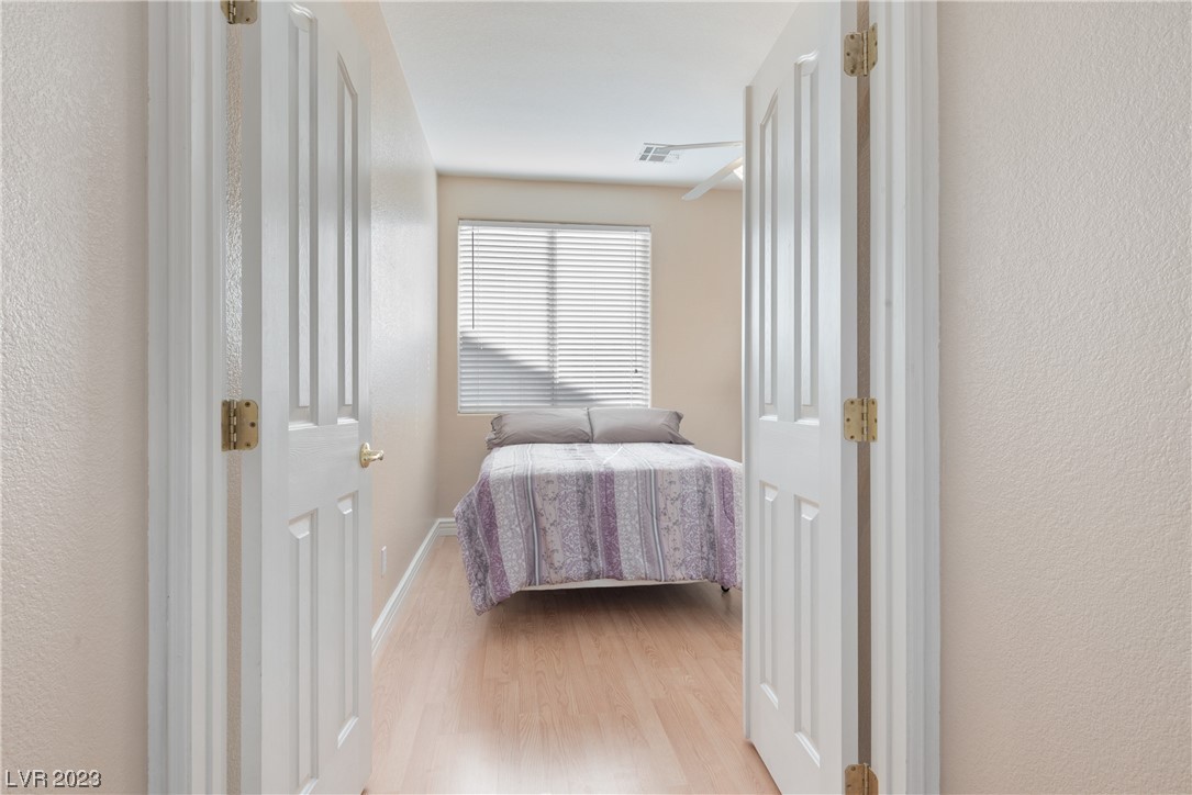98 Milicity Road Henderson, NV 89012 - Photo 19 of 26 The versatile downstairs bedroom features double d