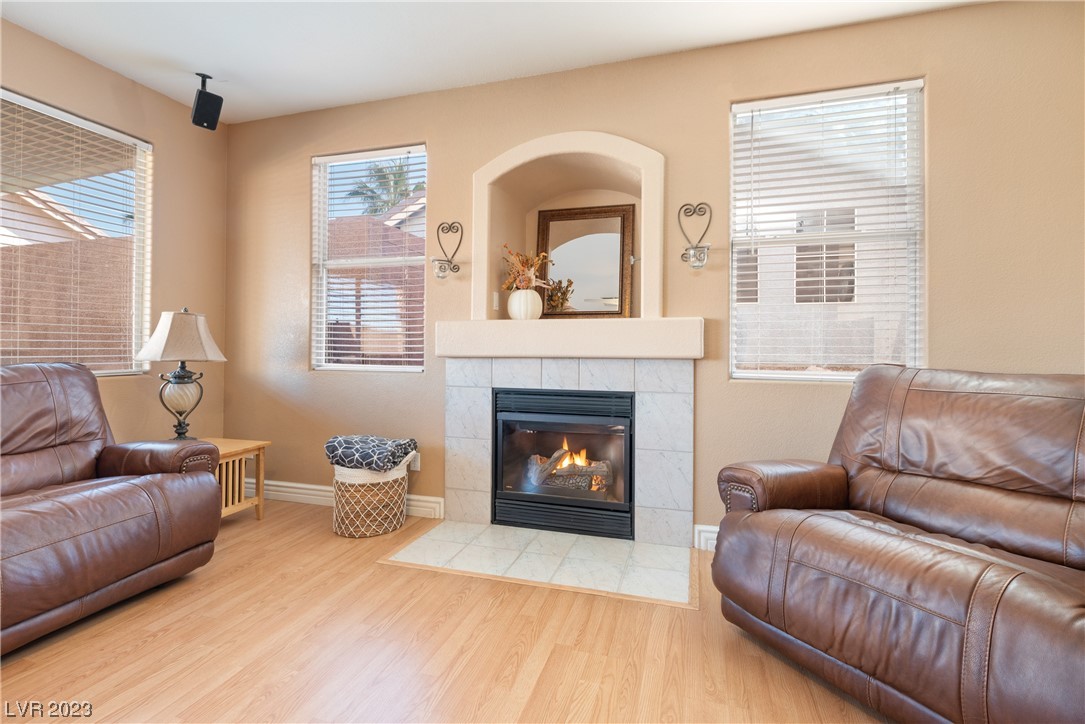 98 Milicity Road Henderson, NV 89012 - Photo 10 of 26 Cozy living space highlighted by a gas fireplace w