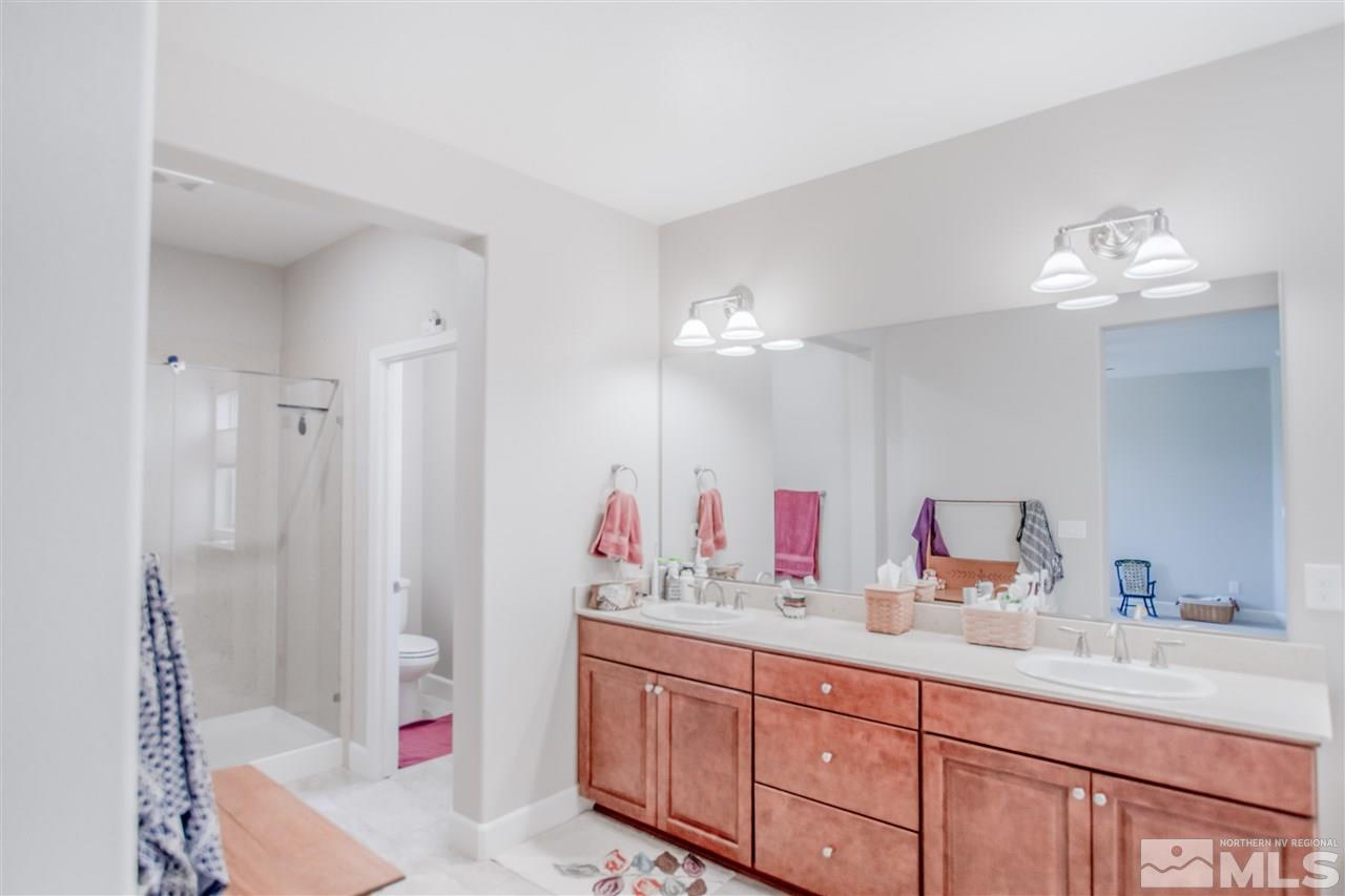 1705 Scott Valley Road Reno, NV 89523 - Photo 11 of 16 a bathroom with double vanity sink and a mirror