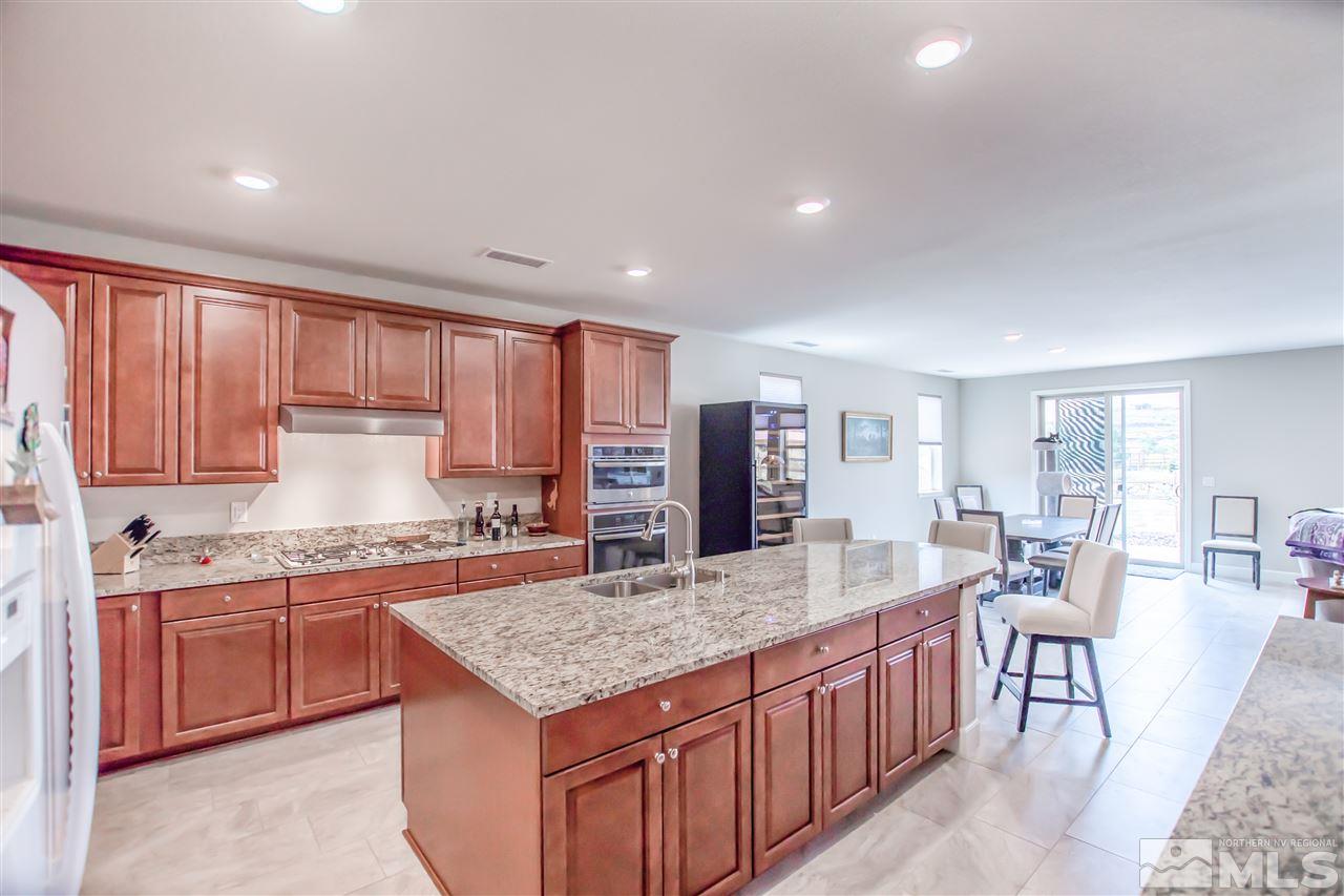 1705 Scott Valley Road Reno, NV 89523 - Photo 2 of 16 a kitchen with a stove a sink and a refrigerator