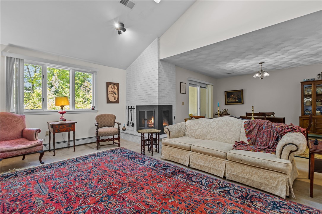 2970 Mendon Road, Unit 101 Cumberland, RI 02864 - Photo 8 of 49 Living Room with Wood-burning Fireplace