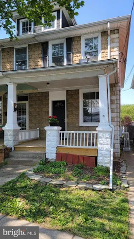 a front view of residential houses with yard