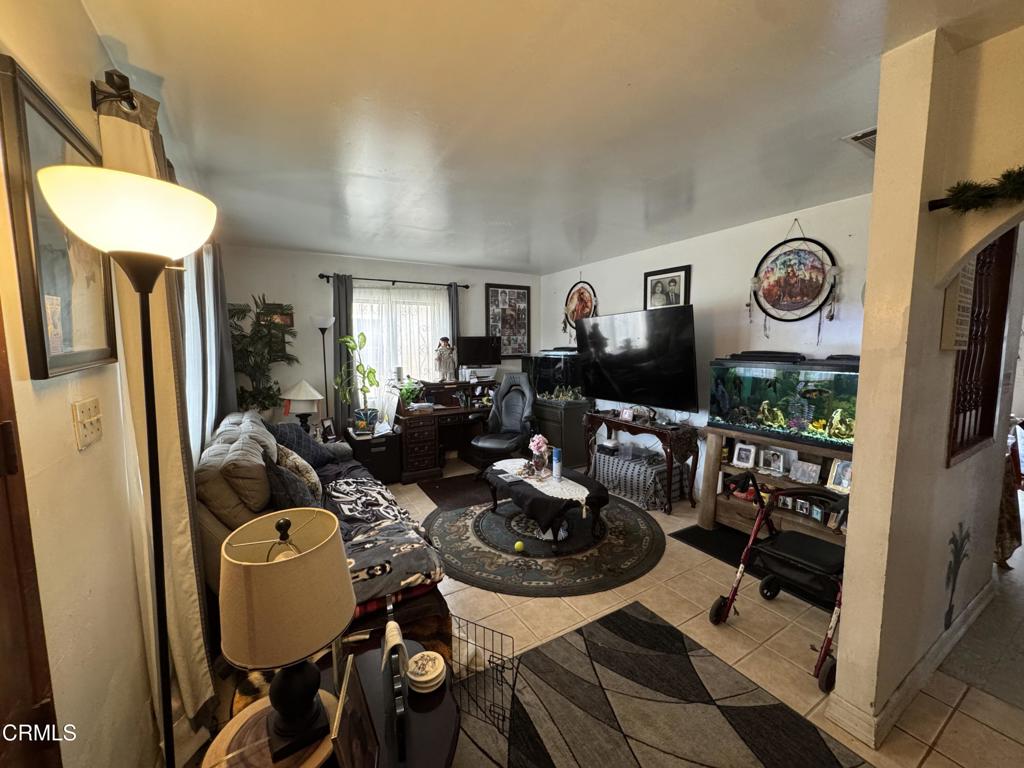 1214 South Ventura Road Oxnard, CA 93033 - Photo 5 of 7 a very nice looking room with lots of furniture and a mirror