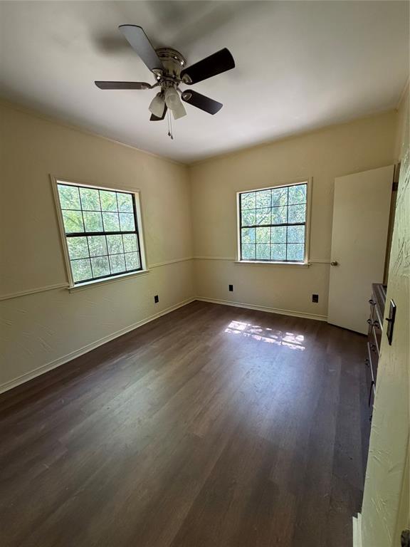 257 West Acres Road Gun Barrel City, TX 75156 - Photo 12 of 22 an empty room with wooden floor chandelier and windows