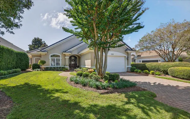 a front view of a house with a garden and porch
