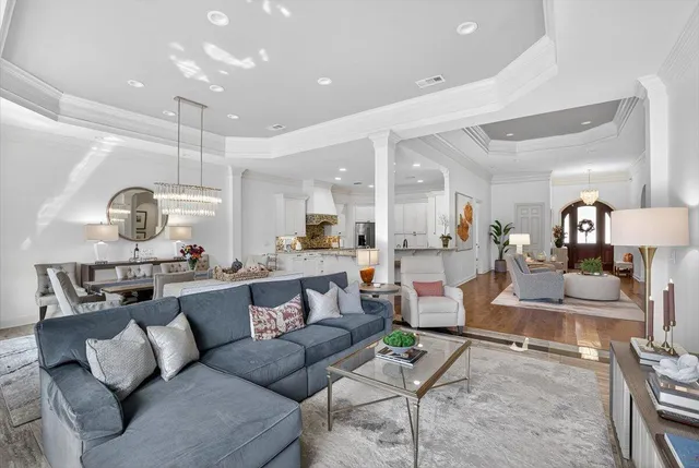 a bathroom with a granite countertop tub sink and mirror