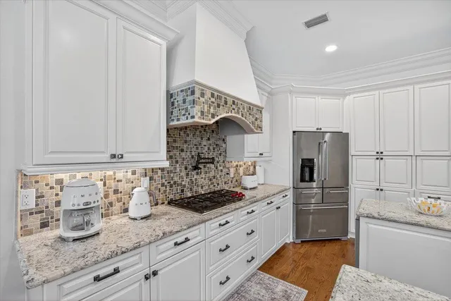 a living room with furniture kitchen view and a table