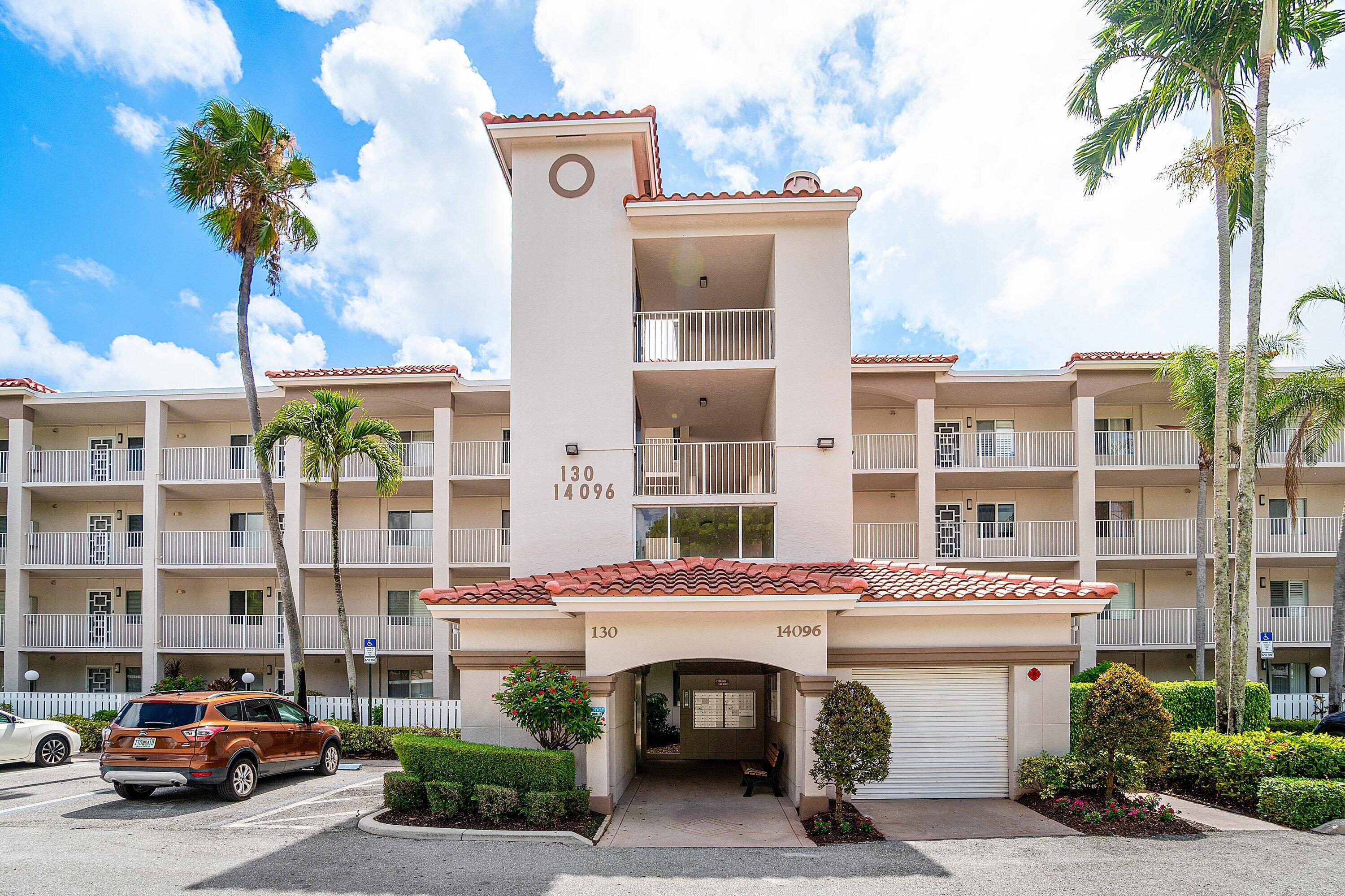 14096 Huntington Pointe Drive, Unit 106 Delray Beach, FL 33484 - Photo 1 of 47 a couple of cars parked in front of a building