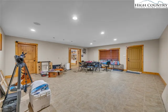 a view of a room with furniture and gym equipment