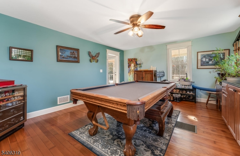 21 Frontage Road Blairstown, NJ 07825 - Photo 13 of 49 a living room with a table chairs and wooden floor