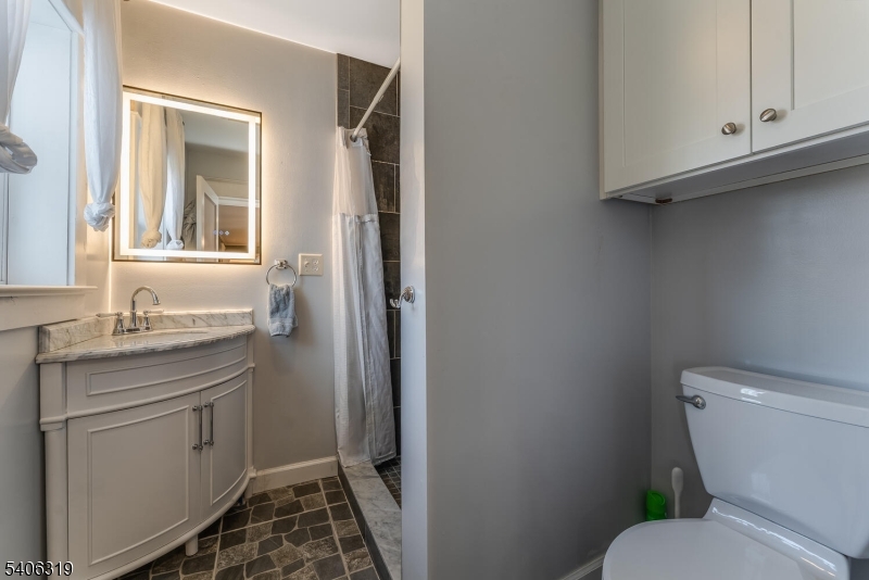 21 Frontage Road Blairstown, NJ 07825 - Photo 18 of 49 a bathroom with a granite countertop toilet sink and mirror