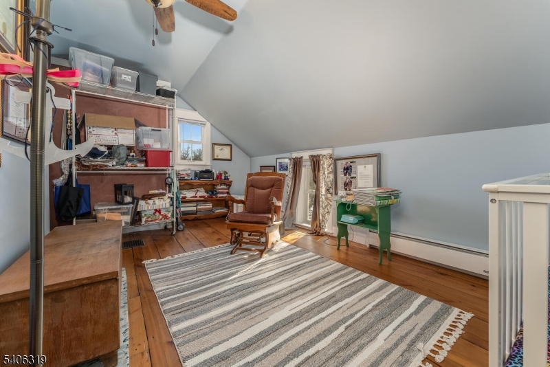 21 Frontage Road Blairstown, NJ 07825 - Photo 25 of 49 a living room with lots of furniture and a book shelf