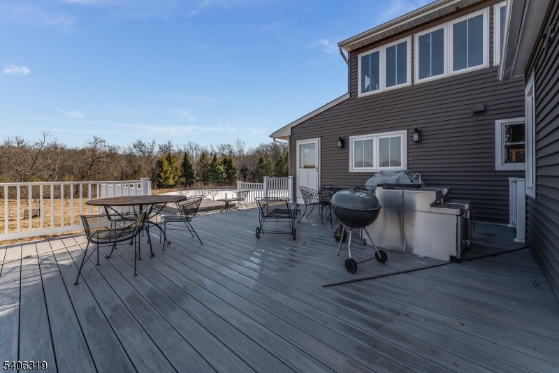 21 Frontage Road Blairstown, NJ 07825 - Photo 28 of 49 a view of a chairs and table on the wooden deck