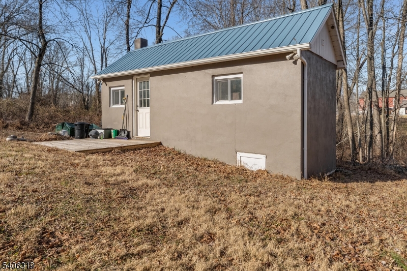 21 Frontage Road Blairstown, NJ 07825 - Photo 38 of 49 a backyard of a house with large trees and outdoor space