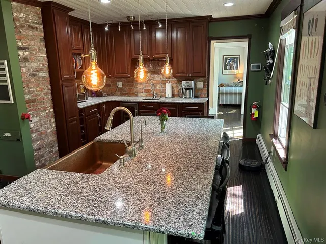 a kitchen with a table and chairs