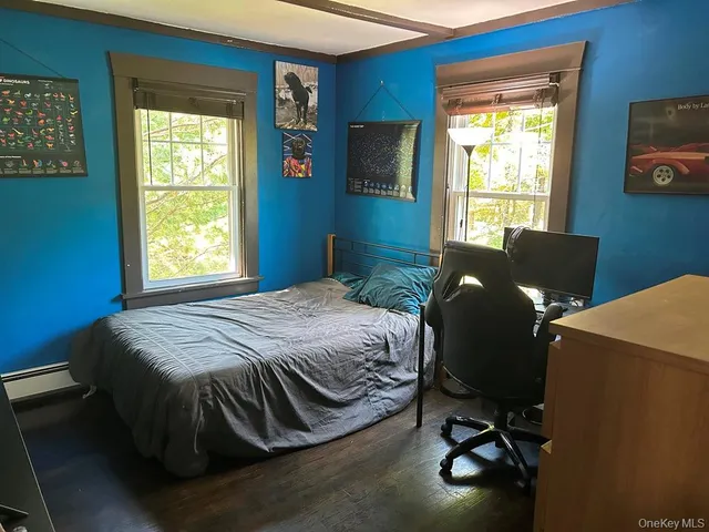 a view of a livingroom with furniture and windows