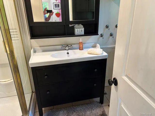 a view of a room with a table and chairs