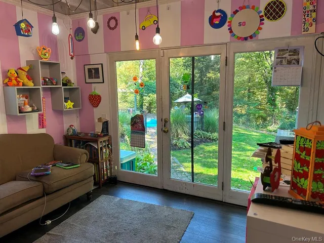 a bathroom with a shower a toilet and a sink