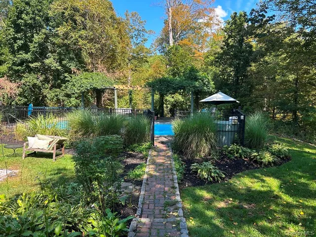 a view of house with yard