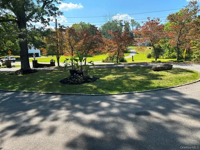 a view of street with parked cars