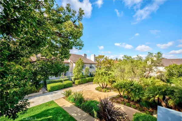 a view of a garden with houses