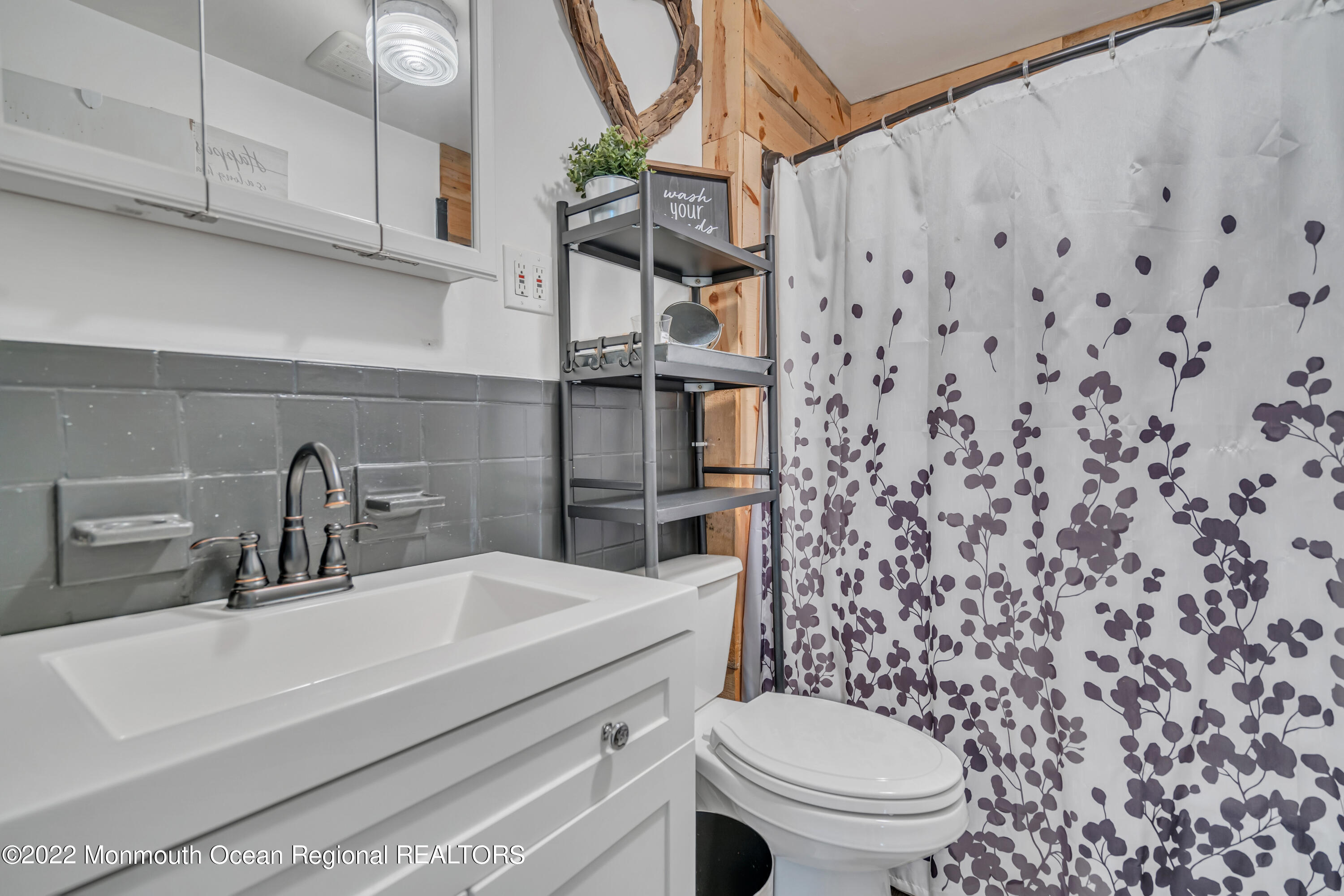 415 Shady Lane Howell, NJ 07731 - Photo 11 of 20 a bathroom with a sink a toilet and shower