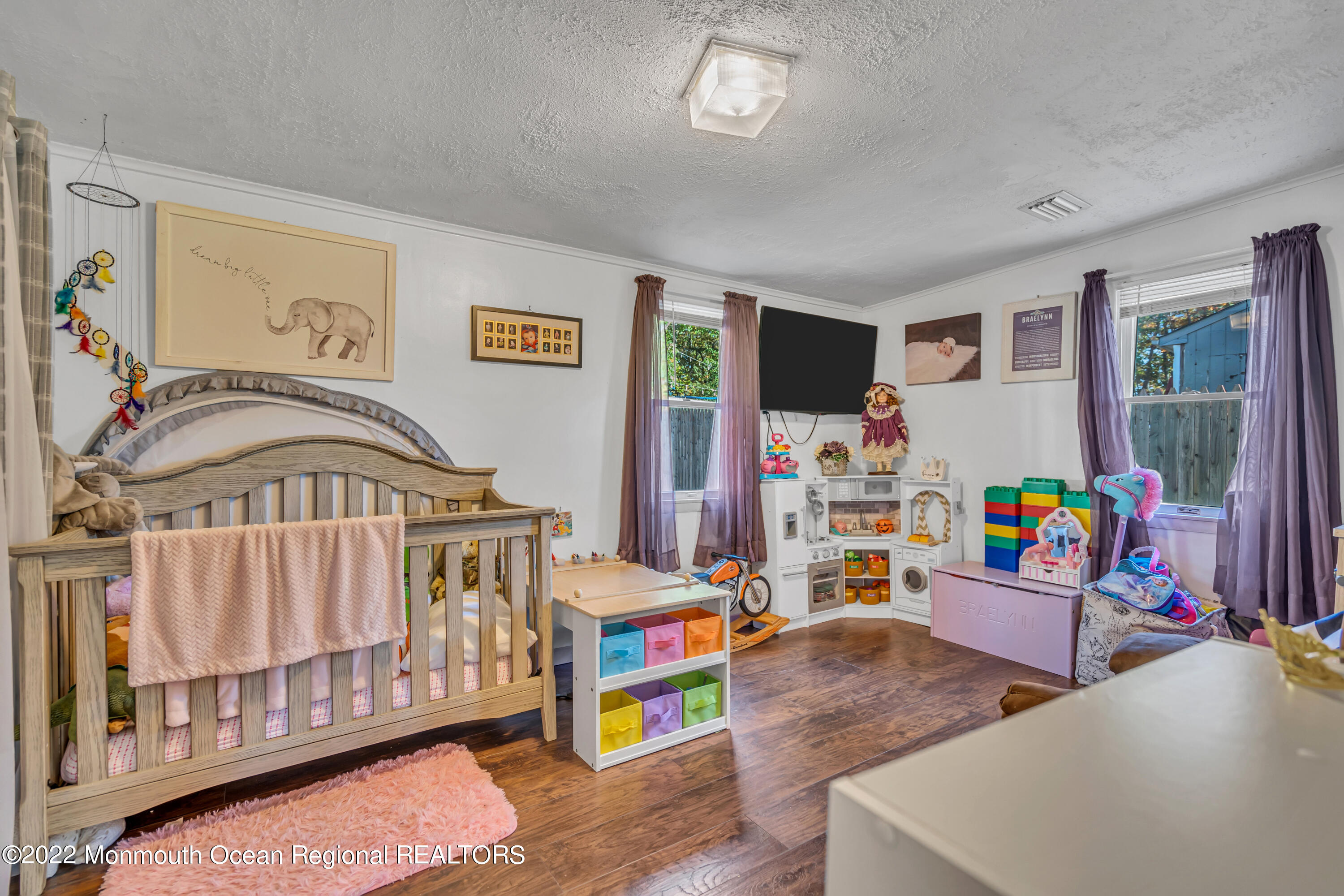 415 Shady Lane Howell, NJ 07731 - Photo 12 of 20 a bedroom with furniture and a wooden floor