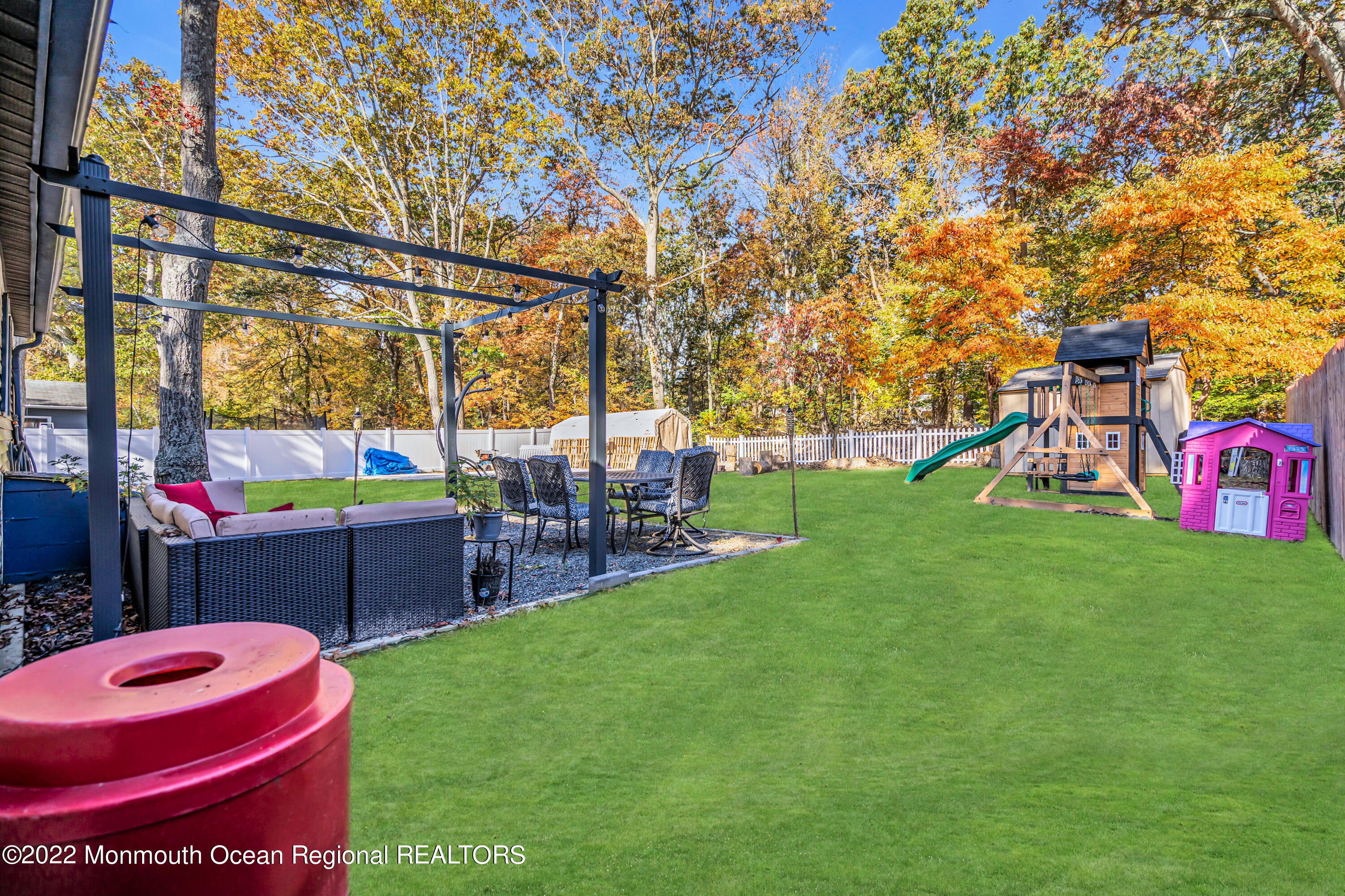 415 Shady Lane Howell, NJ 07731 - Photo 19 of 20 a backyard of a house with table and chairs