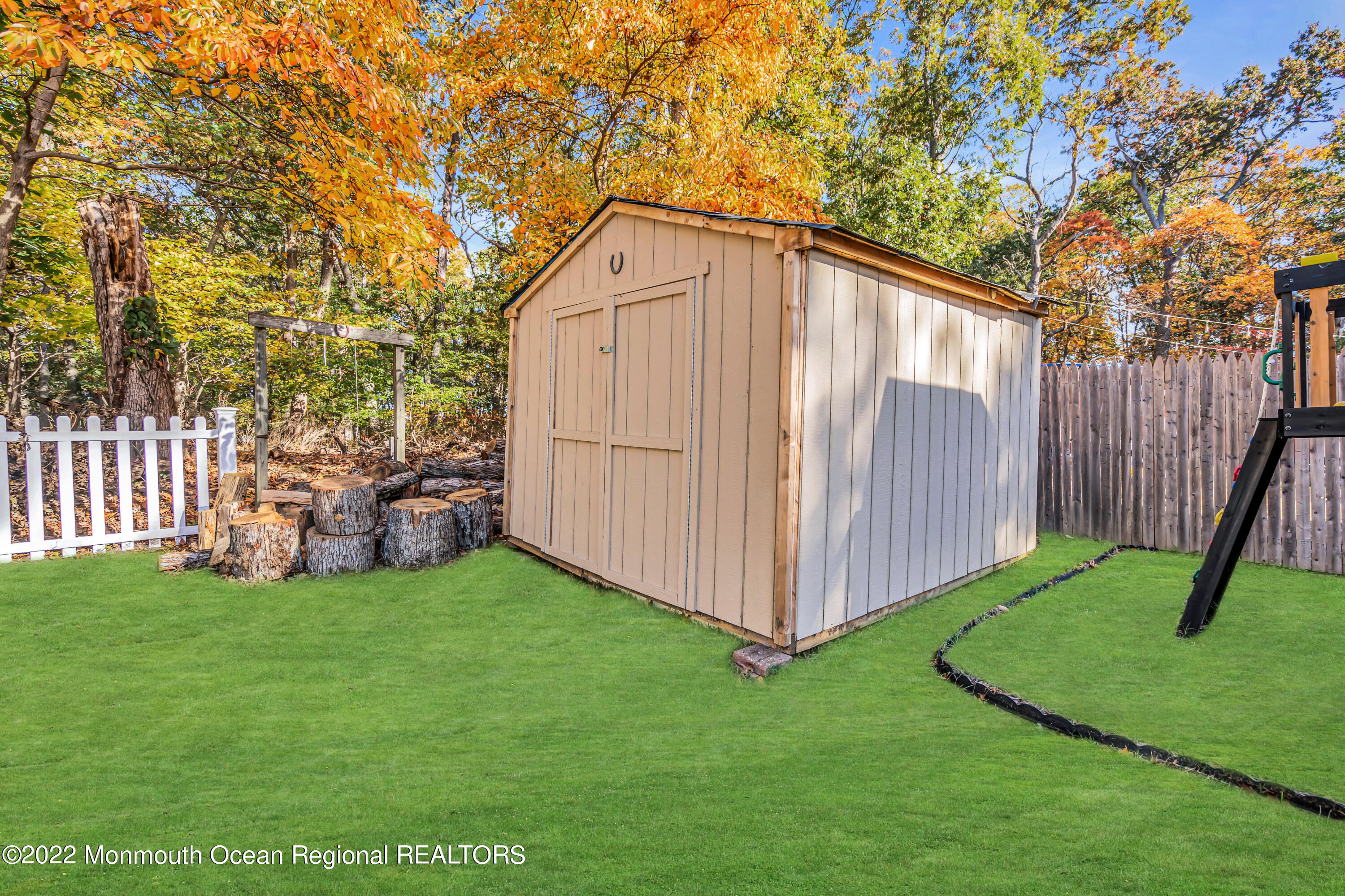 415 Shady Lane Howell, NJ 07731 - Photo 20 of 20 a view of a backyard with wooden fence