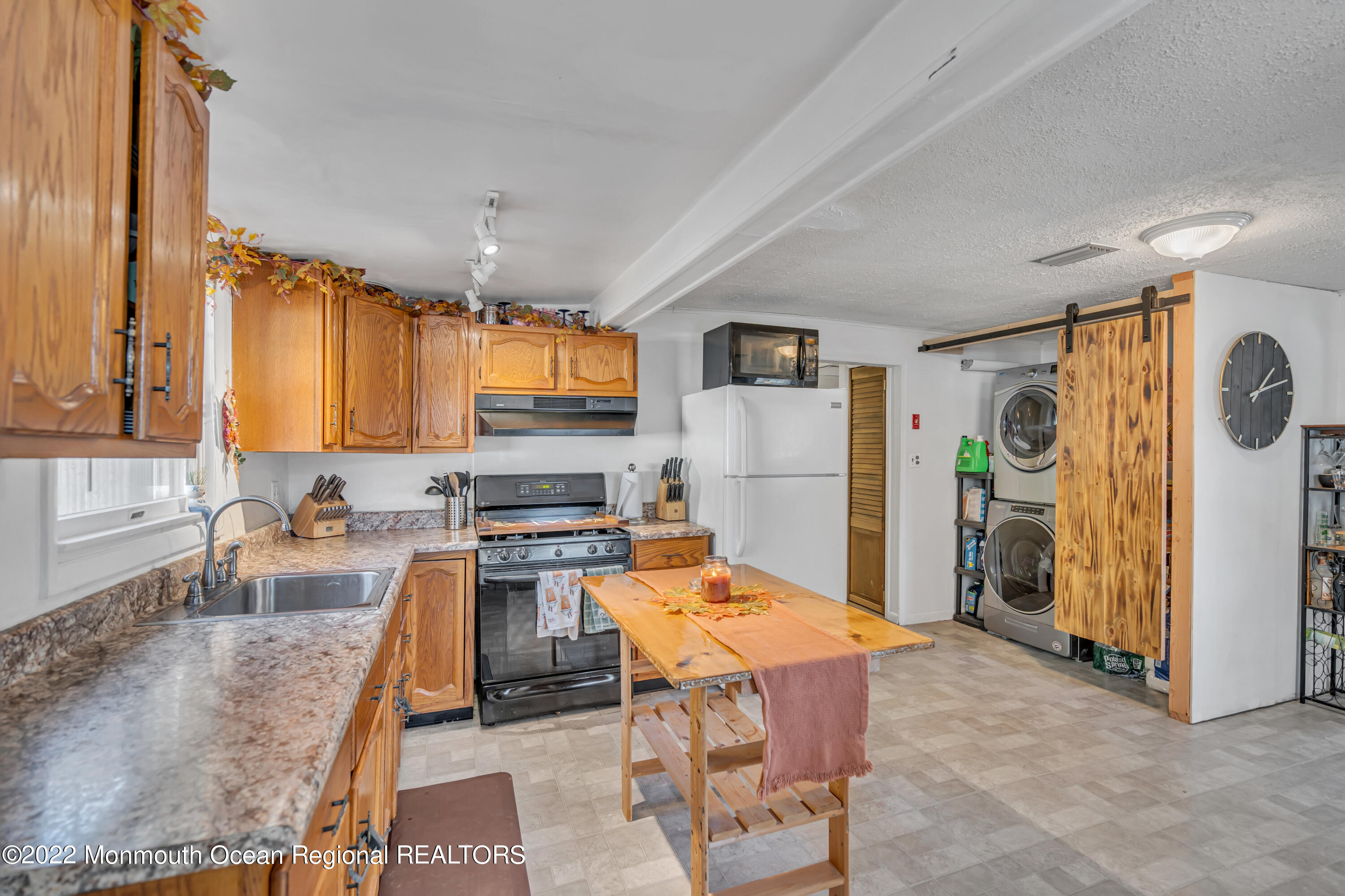 415 Shady Lane Howell, NJ 07731 - Photo 8 of 20 a kitchen with granite countertop a refrigerator stove top oven and sink